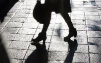 Legs of young woman walking